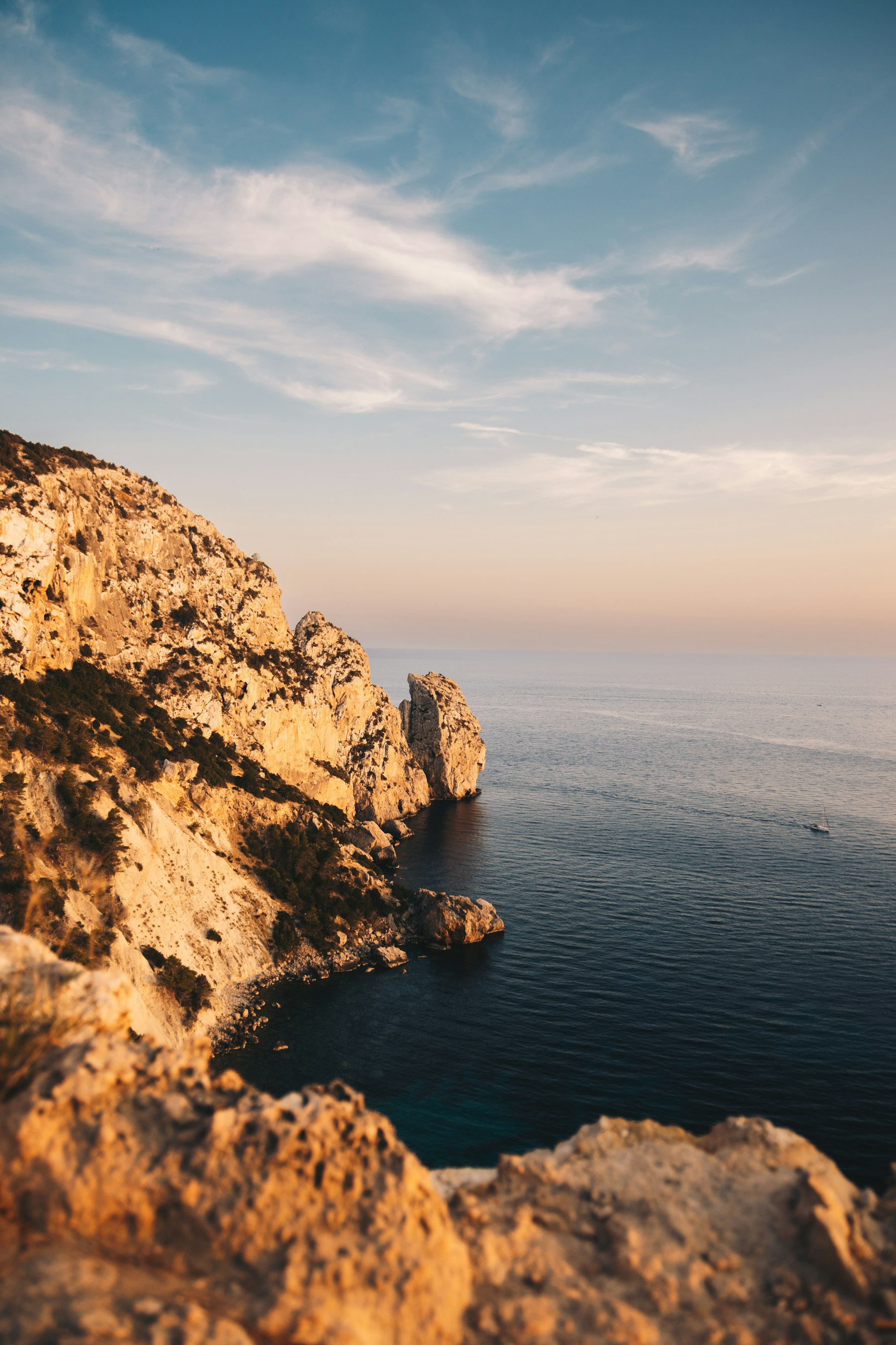 Golden-hour light over Ibiza’s rocky Mediterranean coastline